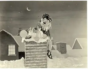 Clara Bow Sitting on Chimney with Toys