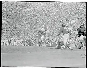 Ann Arbor Prints: Clarence Peaks Running with Football