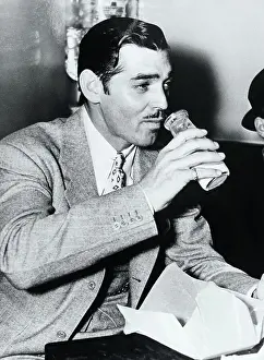 Clark Gable Having a Drink