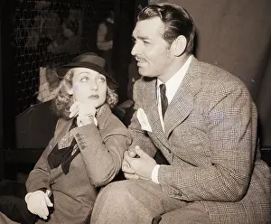 Hand On Chin Prints: Clark Gable Seated by Carole Lombard