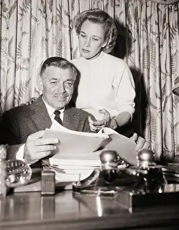 Clark and Kay Gable at Desk at Home