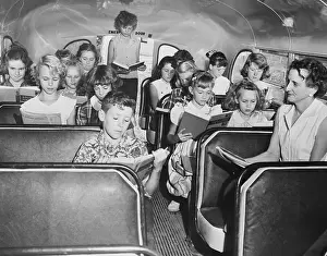 Topeka Prints: Class Taking Place In A Bus