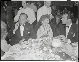 Claudette Colbert Having Diner with Friends