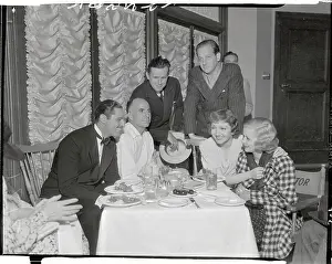 Claudette Colbert at Party with Friends