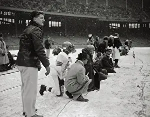 Snowfall Prints: Cleveland Browns Game Being Observed by Coach on Sideline