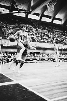 Cliff Hagen Sweeping Up to Basket