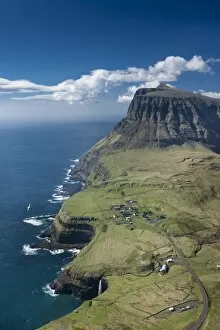 Faroe Islands Collection: Cliffs and a small village, Gasadalur, Vagar, Faroe Islands, Denmark