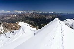 Climber descending Mt Piz Palu, on the summit ridge, Grisons, Switzerland, Europe