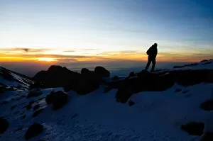 Volcano Collection: Climber Summiting Mt. Kilimanjaro