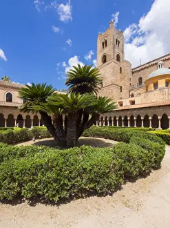 Cloister with ornate pillars at Monreale Cathedral or Cathedral Santa Maria Nuova, Monreale, Sicily, Italy