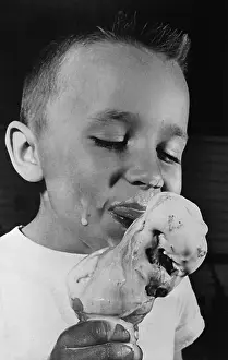 Messy Prints: Close Up of Boy Eating Melting Ice Cream Cone