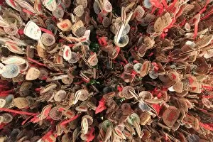 Lijiang Gallery: Close up of hand written prayers hanging on a roof
