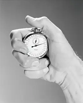 Only Mature Men Prints: close up man's hand using stop watch indoor