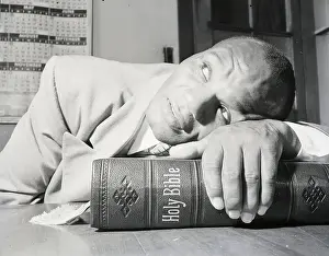 Close-Up Of Joe Walcott Resting On Bible