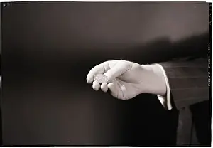 Luck Prints: Close-Up Of Man's Hand Flipping Coin