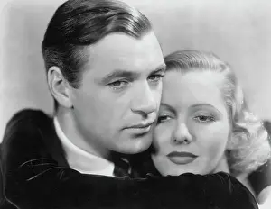 Closeup Gary Cooper Embraces Jean Arthur