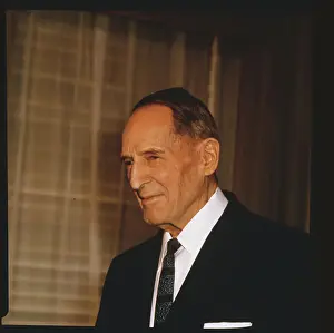 Closeup of General MacArthur wearing dark business suit