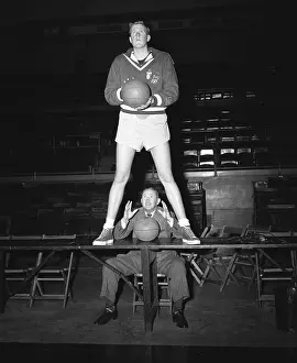 Clyde Lovellete Standing on Table