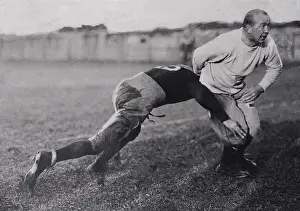 Coach Knute Rockne Teaching Tackling to Football Player