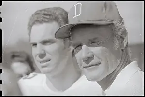 Coach and Quarterback Watching Practice