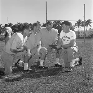 Coach Ray Parker with football players Preston Carpenter, Buddy Dial and John Burrell
