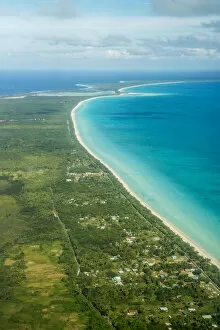 Coastline with beach and village, Ouvea island, New Caledonia