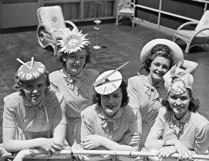 Coeds Wearing Clock Hats