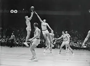 College Basketball Players in Action at Garden