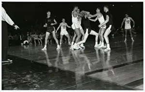 College Basketball Players on Court