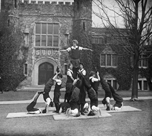 Teamwork Prints: College students performing acrobatic activities
