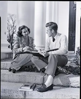 Studying Prints: Two College Students Seated On Steps
