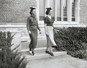 College Women Balancing Books on Heads