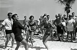 Swim Trunks Prints: Two College Women Dancing on Beach
