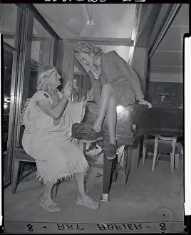 Collette Chambeau Sitting on Piano with Musical Teacher