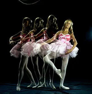 Prints of NEW YORK - 1976: An artistic, pre-Photoshop montage (created in the darkroom by layering negatives together) of a teenage ballet dancer in motion in 1976 in New York City, New York The Enchanting Evolution of Ballet: Color Photo Montage of teenage ballet dancer in motion