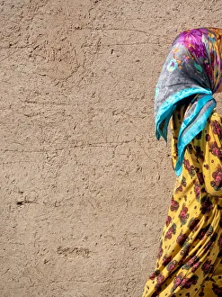 Adobe Collection: Colorful dressed girl in Yazd adobe old town, Iran