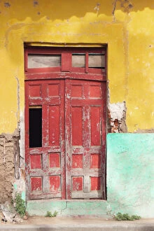Images Dated 18th March 2018: Colorful facade and red door at old colonial house in Granada, Nicaragua