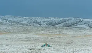 Mid Distance Prints: a colorful flag tent over snow field