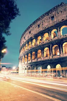 Colorful Gallery: Colosseum at night with light trails from cars