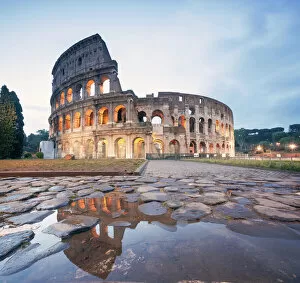 Historical Collection: Colosseum reflected at sunrise, Rome, Italy