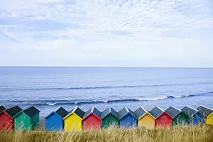 Images Dated 23rd September 2013: Colourful beach huts along the seafront