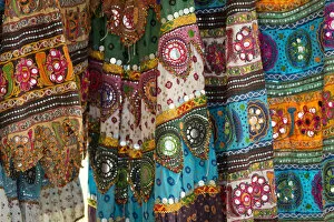 Colourful skirts inlaid with mirrors and different patterns, detail, Udaipur, Rajasthan, India