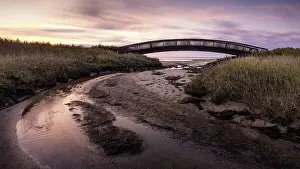 Bridges Prints: Colourful sunrise behind the Luegenbruecke on the mudflats in the east of the North Frisian island of Sylt