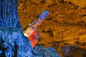 Images Dated 13th December 2009: Colourfully, illuminated stone penis-shaped rock formation in Hang Sung Sot cave, Surprise Cave