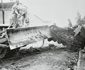 Caterpillar Track Prints: Combat engineers Clearing Rubble