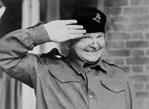 Comedian Benny Hill Saluting in His Television Show