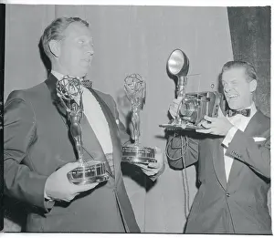 Emmy Award Ceremonies Prints: Comedian Robert Cummings Photographing Art Linkletter Holding Awards