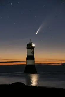 Comet NEOWISE and the Night Sky above Trwyn Du Lighthouse or Penmon Point Lighthouse