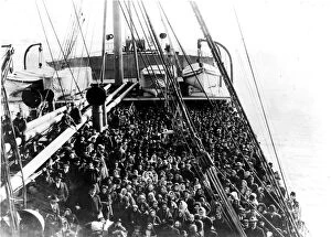 Steamboat Gallery: Coming To America; Immigrants pack the upper deck of the liner SS Patricia as it