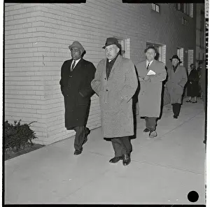 Communist Sympathizers Walking on Sidewalk